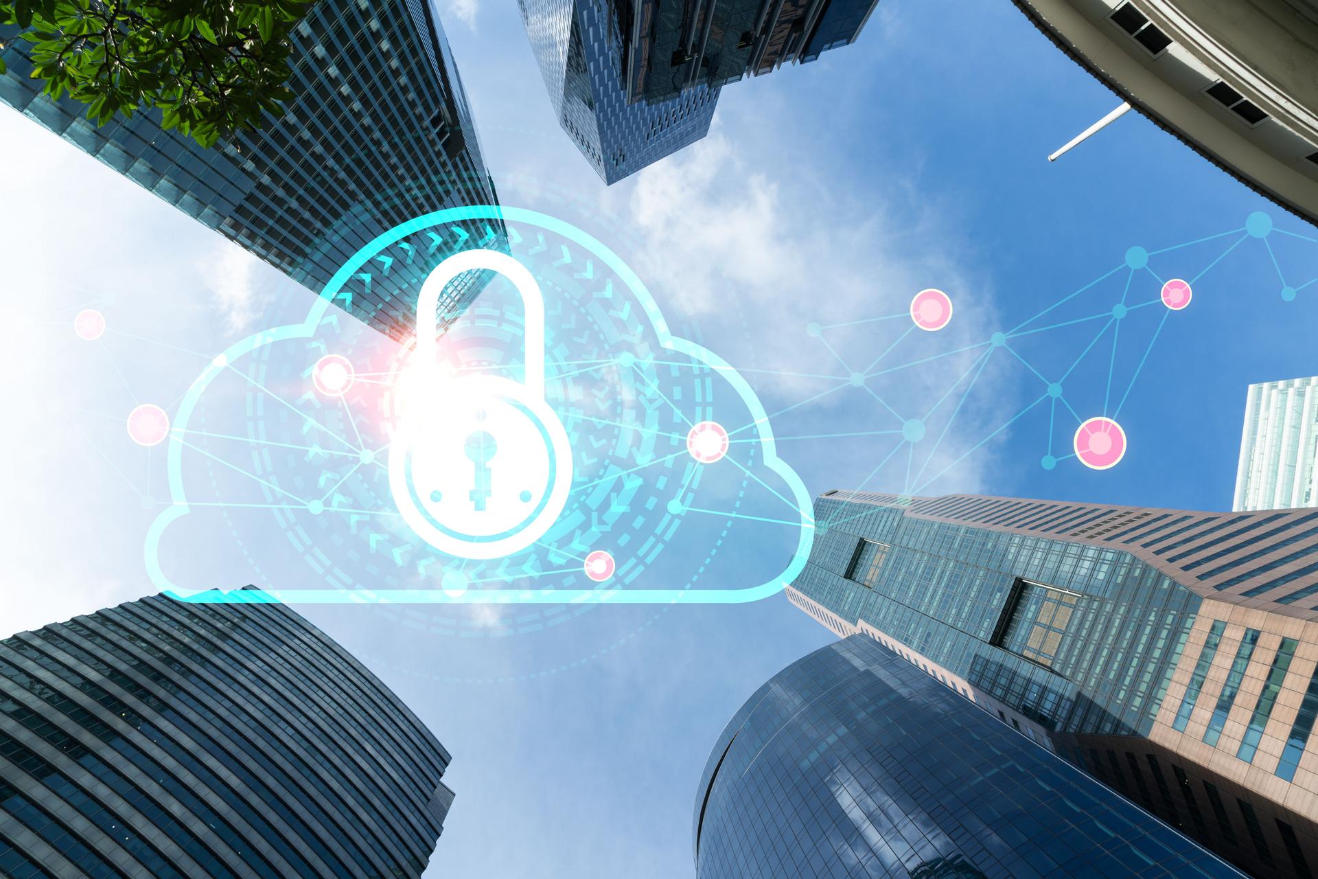 Padlock icon hologram on low, wide angle view of glass and steel contemporary skyscrapers in financial downtown. The concept of success in cyber security intelligence. Multi exposure.